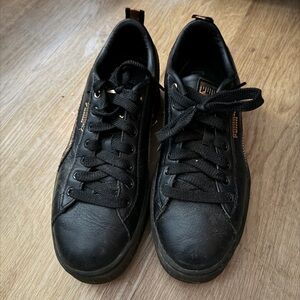 Puma Black Leather Low-Top Sneakers with Gold Accents